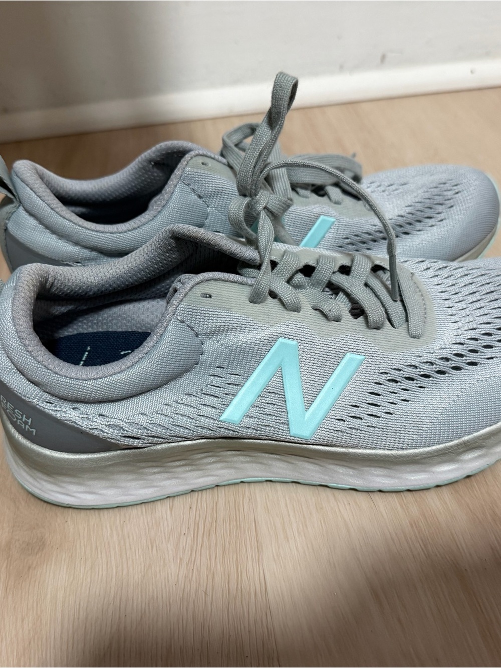 New Balance Gray Sneakers with Aqua Logo Accent